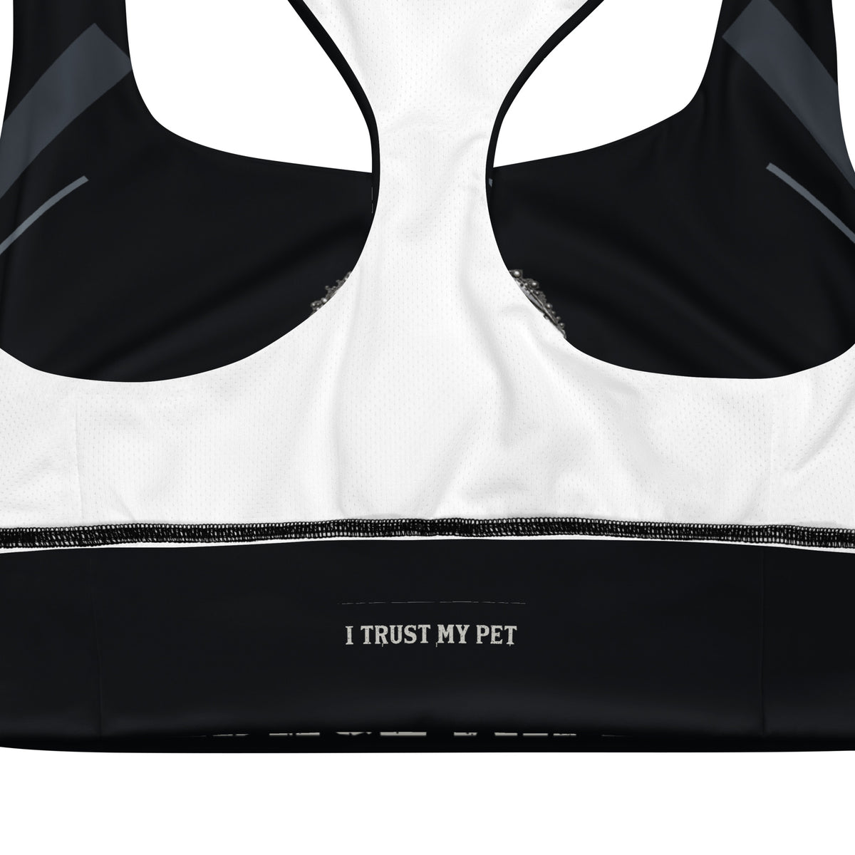 Inside of the I Trust My Pet™ Nightline longline sports bra showing white mesh lining and a black band with the brand label