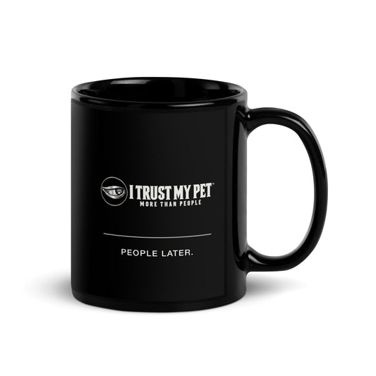 I Trust My Pet™ Coffee First black ceramic mug, 11 oz, with the complete logo and “People later.” artwork, handle on right.