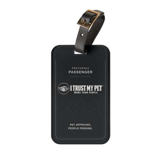 I Trust My Pet™ Preferred Passenger black luggage tag with the full logo, silver border, and adjustable leather strap, front view.