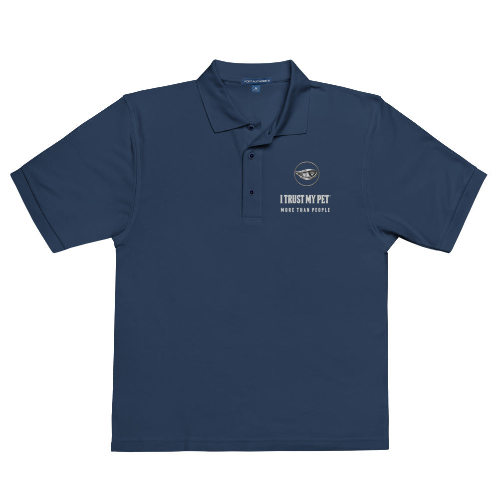 Navy Quiet Authority men’s polo laid flat, with the I Trust My Pet™ eye-and-paw, name and More than people embroidered chest badge.