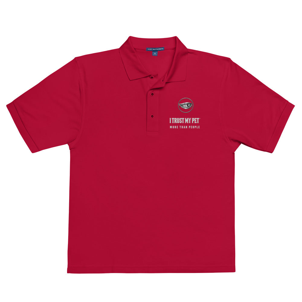 Red Quiet Authority men’s polo laid flat, with the I Trust My Pet™ eye-and-paw, name and More than people embroidered chest badge.