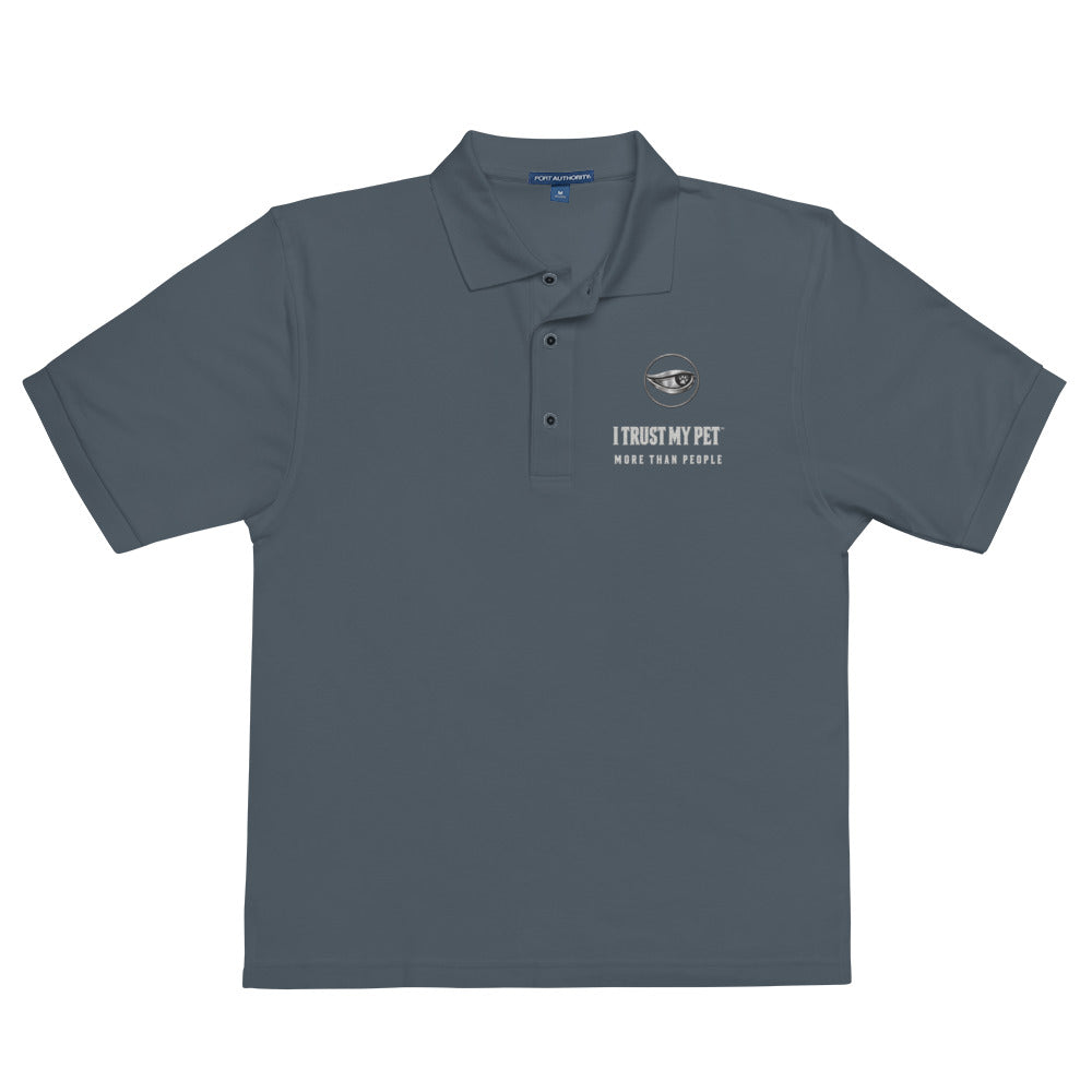 Steel grey Quiet Authority men’s polo laid flat, with the I Trust My Pet™ eye-and-paw, name and More than people embroidered chest badge.
