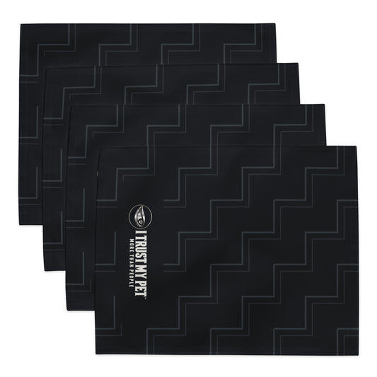 Four black Quiet Company placemats stacked to show the charcoal rising-line pattern and complete I Trust My Pet™ logo.