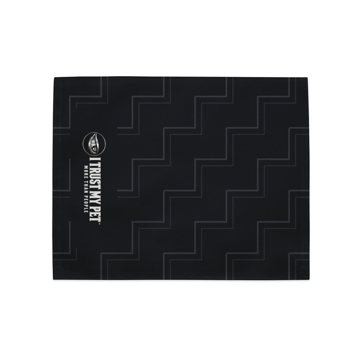 One black Quiet Company placemat laid flat, showing the complete I Trust My Pet™ logo along the side and charcoal stepped pattern.