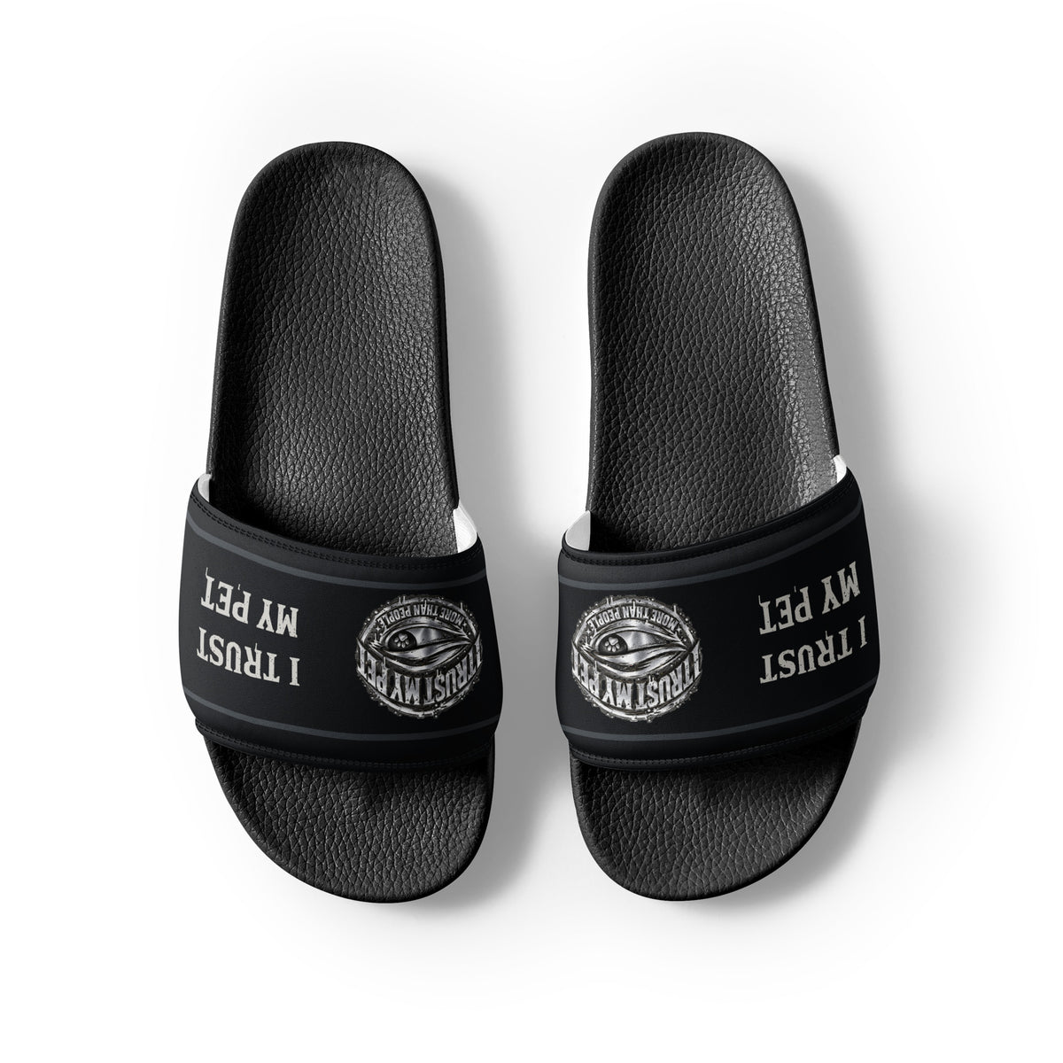 Heel-facing top view of black I Trust My Pet™ Signature Crest slides and textured footbeds
